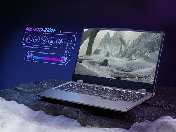 Lenovo LOQ 15IAX9 gaming laptop – right-front view, lid open with arctic scene on the display and MIL-STD 810H graphic to the side